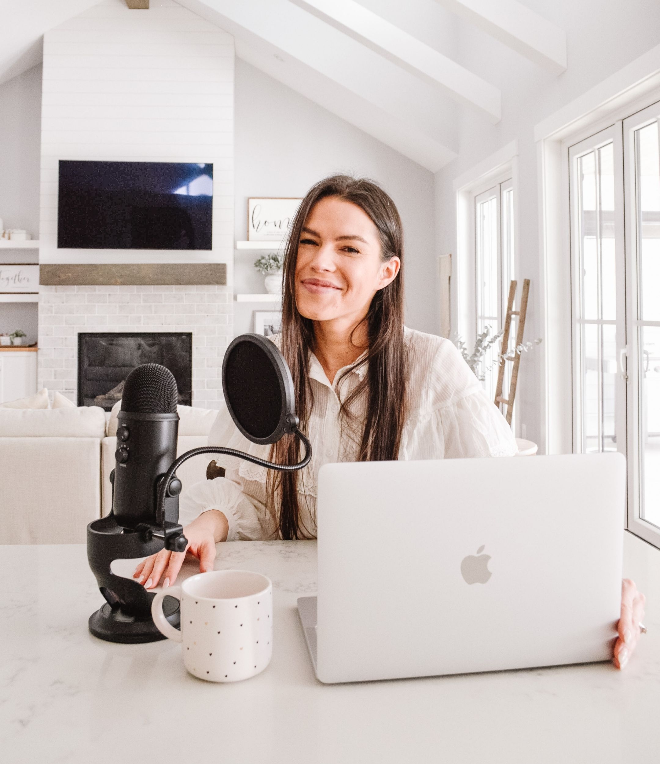 Michaela Fong, founder of Small Biz Babes Community Podcast is sitting in front of the microphone as she will be answering Q&A questions small business owners asked her